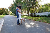 Couple embracing on street