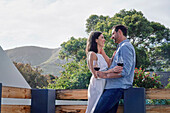 Couple embracing on terrace