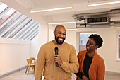 Portrait of smiling creative team having presentation in studio