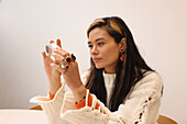 Woman holding glass cube