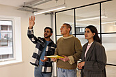 Coworkers talking in empty office