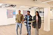 Coworkers talking in empty office