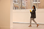 Businesswoman walking in modern office