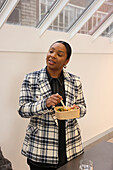 Businesswoman enjoying salad in office