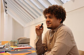 Man holding microphone in office