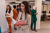 Employee smiling during team meeting