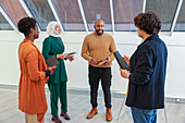 Employees in discussion in office