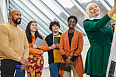 Employees smiling during team meeting in office