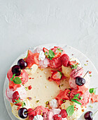 Ice cream cake with berries, melon and mint