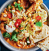 Butter cauliflower with paneer and naan bread