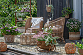 Boho style on the patio with hydrangea, magnificent candle, fragrant stonecrop, elfin spurge 'Pink Panther', yarrow, silver rain, spurge 'Athene', seating area