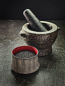 Stone mortar with black sesame seeds