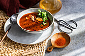 Spicy tomato cream soup with cream cheese and parsley