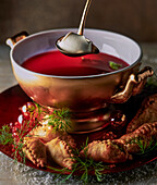 Russian borscht with salmon and pierogi