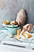 Still life with cheese, bread, potatoes and rice