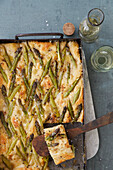 Vegan focaccia with green asparagus and vegan cheese cream