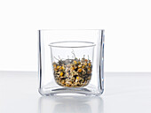 Dried camomile flowers in a jar