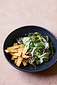 Olive and fennel salad with baked bread sticks and quinoa