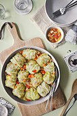 Cabbage rolls in vegetable stock made from celery, tomatoes and carrots