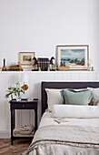 Bedroom with book decoration and landscape painting
