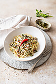 Spaghettini with sardine and almond sauce