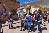 Parishioners carry a statue of the Virgin in a religious procession in the town of Tilcara, Argentina.