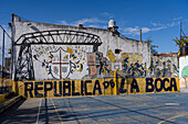 A mural of scenes from La Boca painted on the wall of a basketball court in La Boca, Buenos Aires, Argentina.