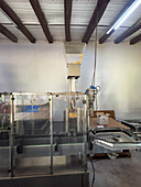 Automated wine-bottle corking machinery in the Bodega Nanni Winery, Cafayete, Argentina.