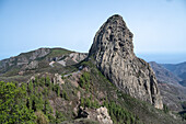 Explore the stunning landscape of Roque de Agando in La Gomera, Canary Islands, with its majestic rock formations and lush greenery. Perfect for nature enthusiasts and adventure seekers.