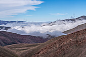 Low clouds in the mountains of the Cuesta de Lipan between Purmamarca and Salinas Grande, Argentina.