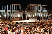 Merida, Spain, Aug 15 2024, A vibrant audience fills the historic Roman Theatre in Merida, Spain, eagerly awaiting a live performance. Captures the essence of cultural heritage and communal excitement.