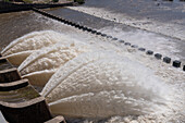 Plumes of water jet from the spillway of the Rio Hondo Dam at Termas de Rio Hondo in Argentina.