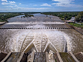 Plumes of water jet from the spillway of the Rio Hondo Dam at Termas de Rio Hondo in Argentina. Downriver is the Tara Inti Natural Reserve, including the small islands.