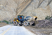 A front-end loader clears debris off National Route 52 after a mudslide between Purmamarca & Salinas Grande, Argentina.