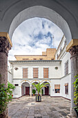 Seville, Spain, Nov 15 2009, The peaceful inner courtyard of the Santa Isabel convent showcases historical architecture and lush greenery in Seville, Spain.