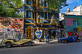 Football or soccer souvenir shop in La Boca, Buenos Aires, Argentina. Pope Francis & football star Diego Maradona statues are on the balconies above.