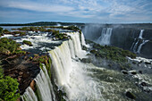 Iguazu Falls National Park in Brazil in the foreground and Argentina behind. A UNESCO World Heritage Site. Pictured is the Floriano Waterfall in front and Salto Two Musketeers and the Three Musketeers Waterfall across the river.