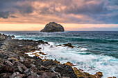 Dramatic long exposure of the rocky coastline of Garachico in Northern Tenerife, Canary Islands, Spain. Captures the rugged beauty and power of the ocean.