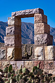 A modern doorway built in the ruins in the Pucara of Tilcara, a pre-Hispanic archeological site near Tilcara, Argentina. It is part of a memorial to the archeologists who excavated the ruins.