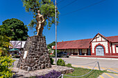 Bronze memorial statue of General Miguel de Guemes in front of the old railroad station in Tartagal, Argentina.