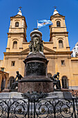 Argentine flag over the tomb of revolutionary General Manuel Belgrano in the atrium of the Santo Domingo Convent in Buenos Aires, Argentina. The national flag of Argentina was designed by Belgrano in 1812.