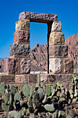 A modern doorway built in the ruins in the Pucara of Tilcara, a pre-Hispanic archeological site near Tilcara, Argentina. It is part of a memorial to the archeologists who excavated the ruins.