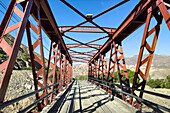 The Puente Tilcara or iron one-lane bridge between Tilcara and the Pucara de Tilcara ruins. Tilcara, Argentina.