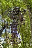 Metal sculpture of La Bruja, a mythical witch creature along a trail in Calilegua National Park in Argentina. It is a character in Argentine folklore.