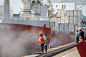 Cargo ship passing through Miraflores Locks in the Panama Canal.