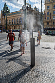 Refreshing water spray fountain to alleviate the high temperatures in summer, Prague