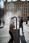 Refreshing water spray fountain to alleviate the high temperatures in summer, Prague