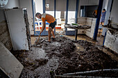 Man cleaning after floods, in the Alfacs campsite, Alcanar, Tarragona, Spain. 3rd Sep, 2023