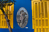 A bas relief sculpture, "Ballarines", of tango dancers by artist Vicente Walter on a wall in Caminito, La Boca, Buenos Aires, Argentina.