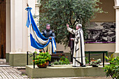 Statues of the blessing of the Argentine flag in the Museum of Sacred Art by the cathedral in San Salvador de Jujuy, Argentina. The statues represent Col. Manuel Belgrano and Father Juan Ignacio Goritti. The flag blessing took place here in 1812 during the Argentine War of Independence from Spain.